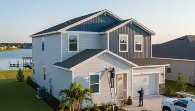 Professional vinyl siding installation on home exterior in Tampa, FL